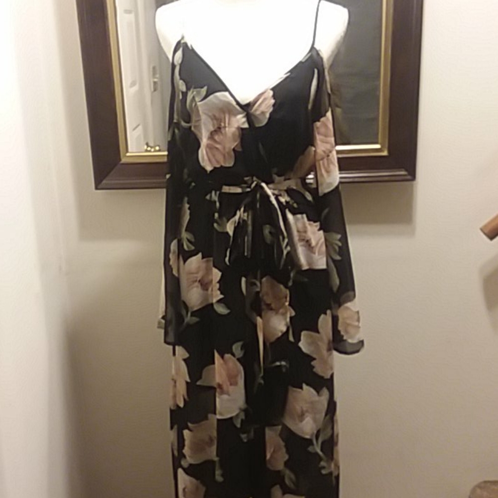A spaghetti strapped, off shoulder floral dress